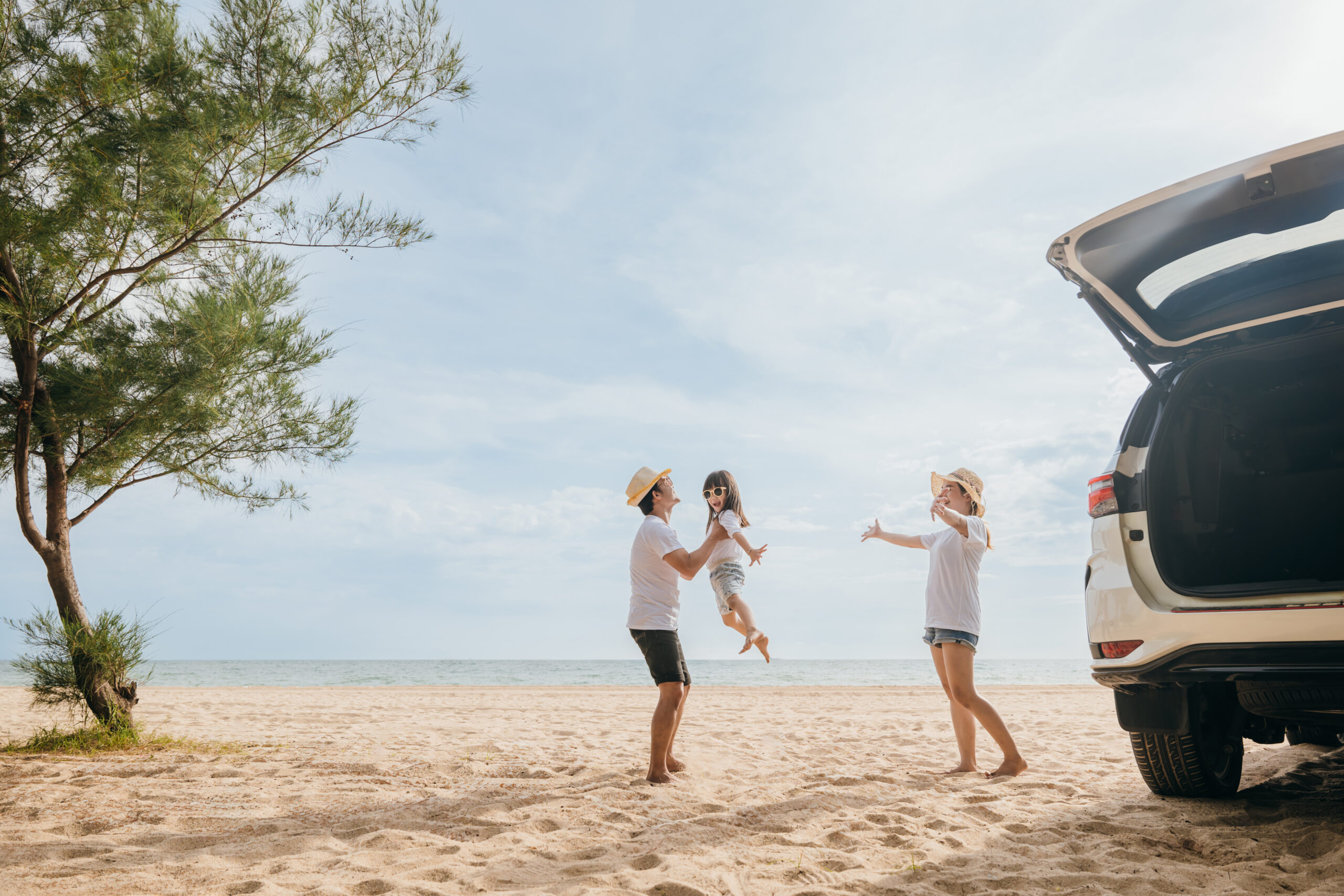 happy family three playing on beach, parents father holding child on his shoulders jump a child fly to air, holiday vacations summer road trip, back car, family day enjoying their time