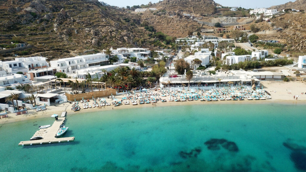 Mykonos Luxury Travel Guide: Premium Beach Clubs and Fine Dining aerial,drone,photo,of,famous,turquoise,clear,water,beach,of